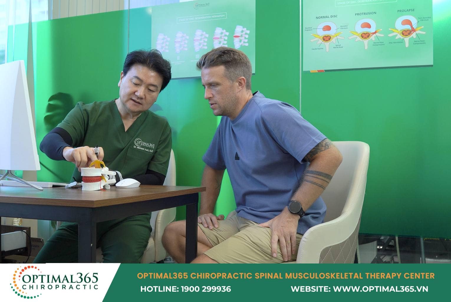 Doctor providing musculoskeletal screening consultation to patient at Optimal365